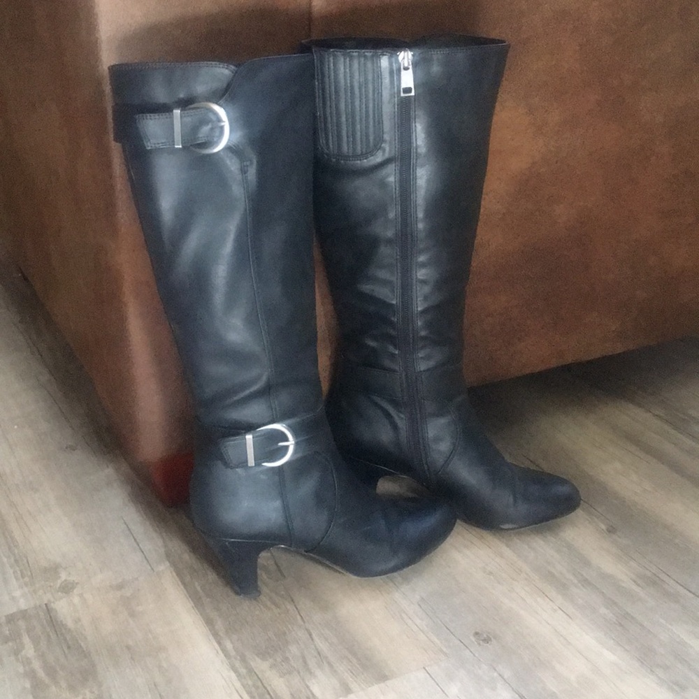Black heeled knee high boots